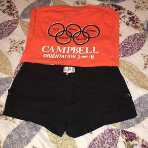An orange Campbell T-shirt and black shorts